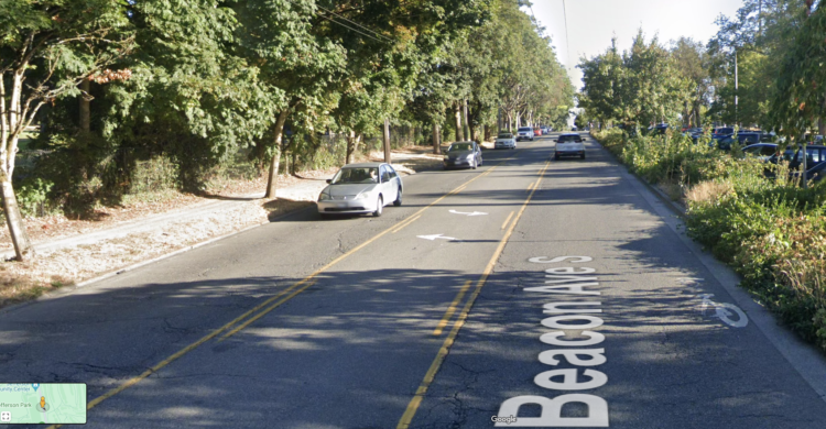 Google Street view image of a sharrow on Beacon Avenue South so worn that only about a third is still visible.